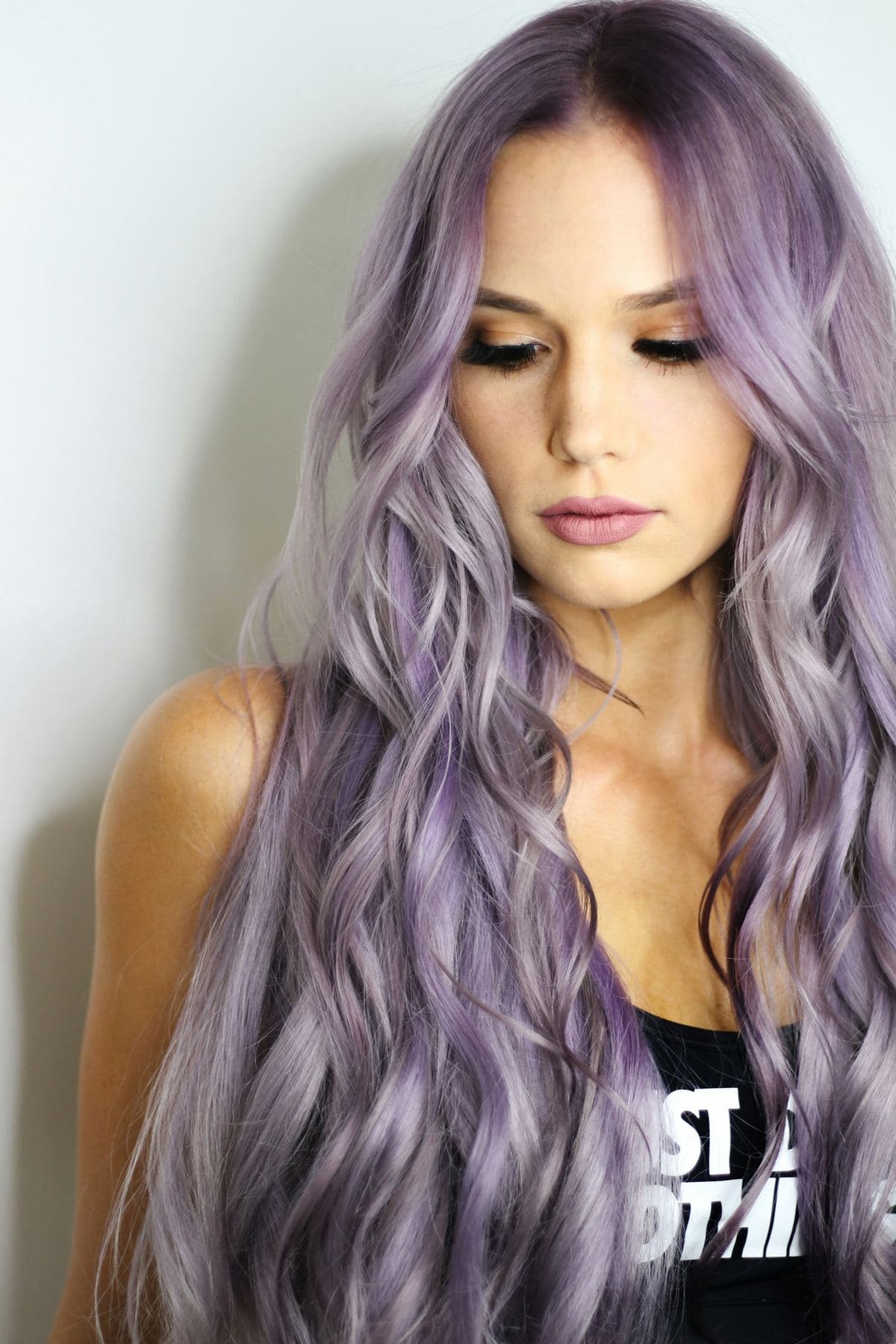 Editorial stock: long cool-blonde waves in studio light. Not client work.