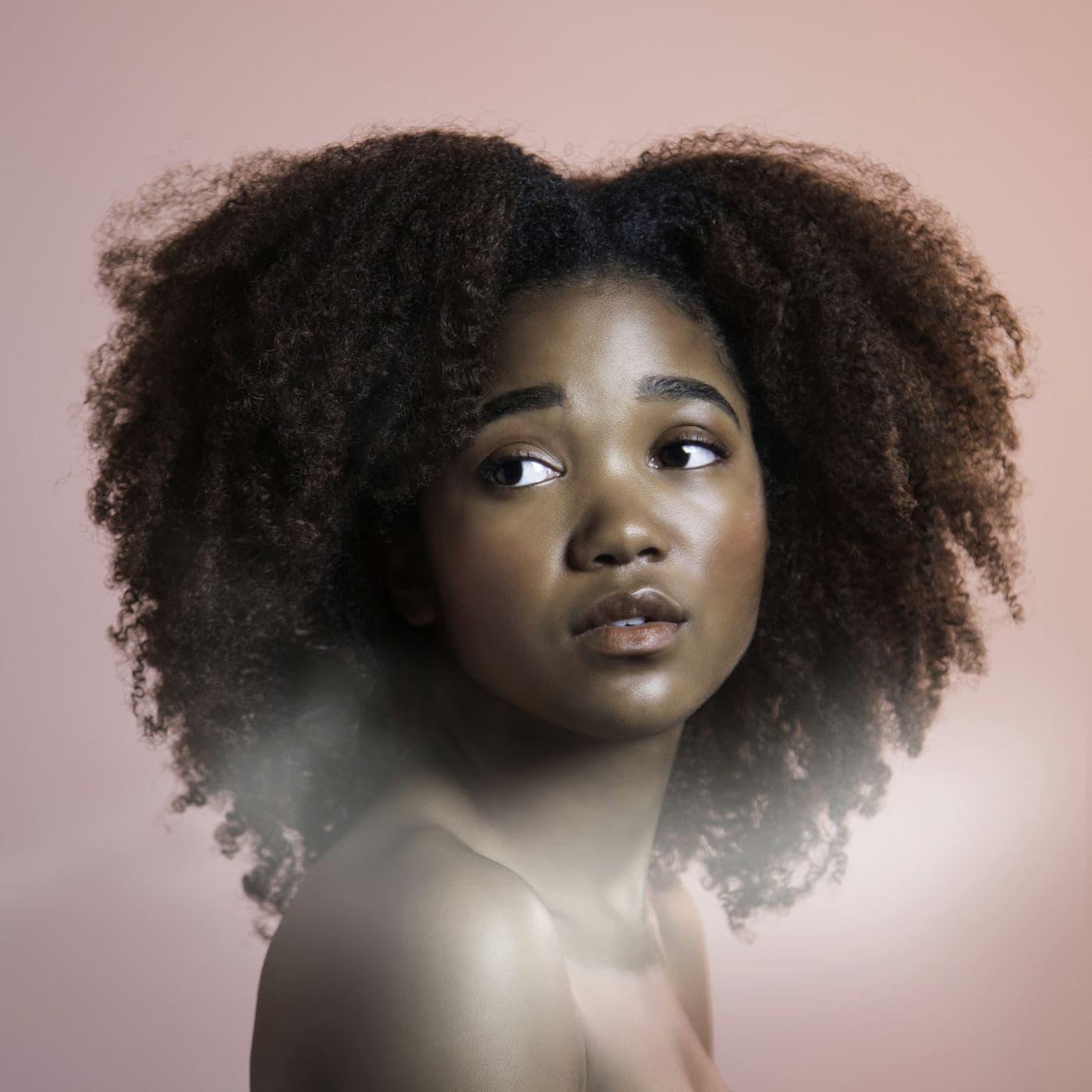 Editorial stock: a sculpted natural-hair shape. Not client work.